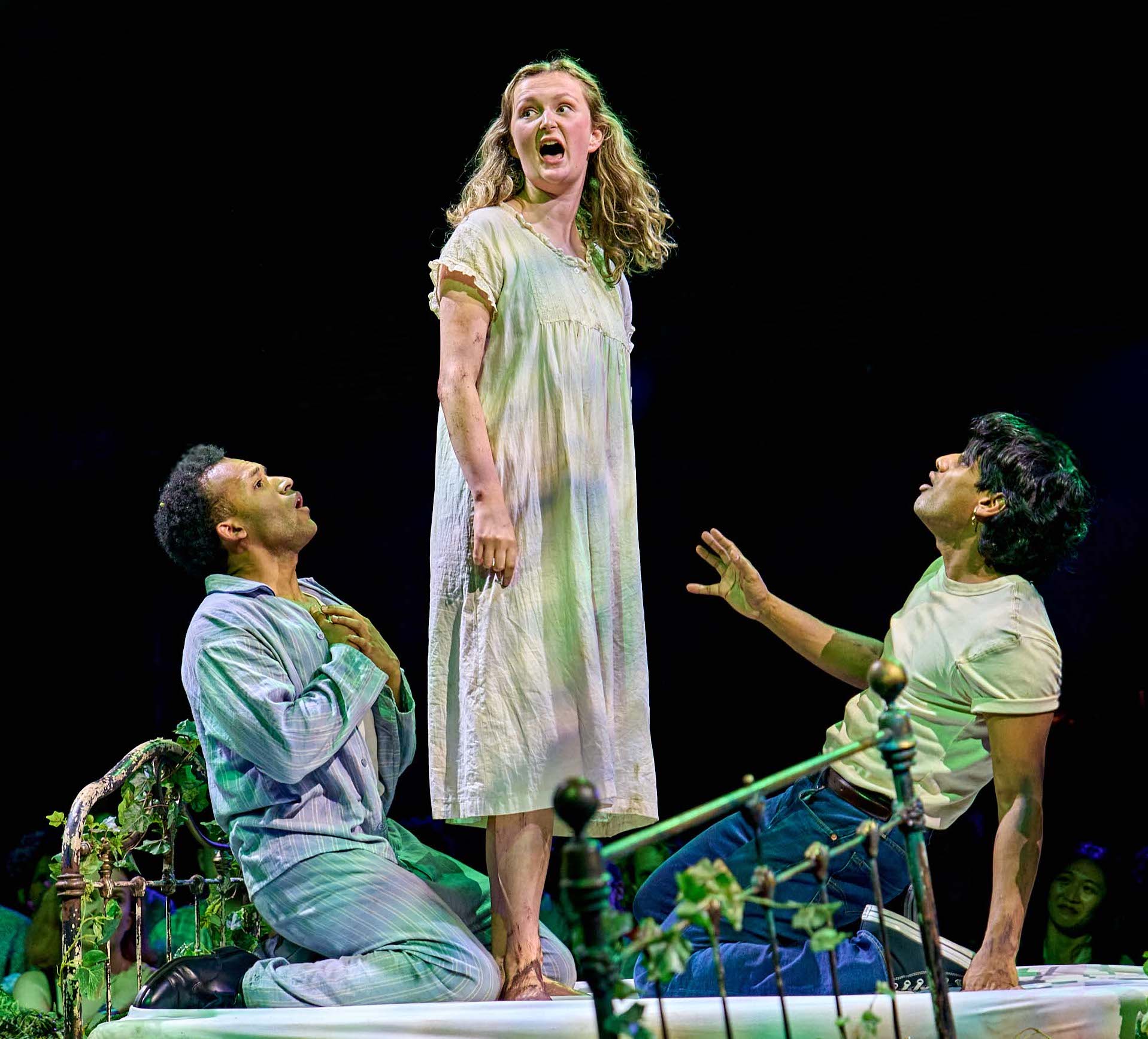Paul Adeyefa as Demetrius, Lily Simipkiss as Helena, Divesh Subaskaran as Lysander in The Bridge's A Midsummer Night's Dream