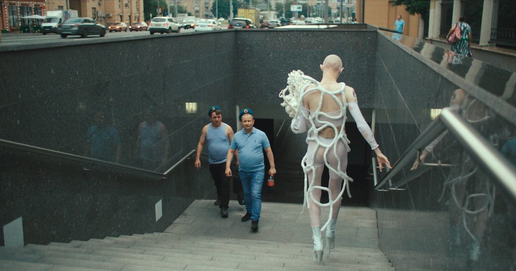 Turning heads.Gena Marvin enters the Moscow subway