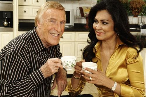 Bruce Forsyth and wife Wilnelia Merced-Forsyth act naturally for the cameras