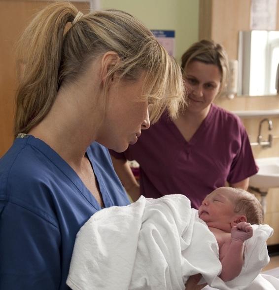 Celebrity talent-spotter Amanda Holden tries her hand at midwifery